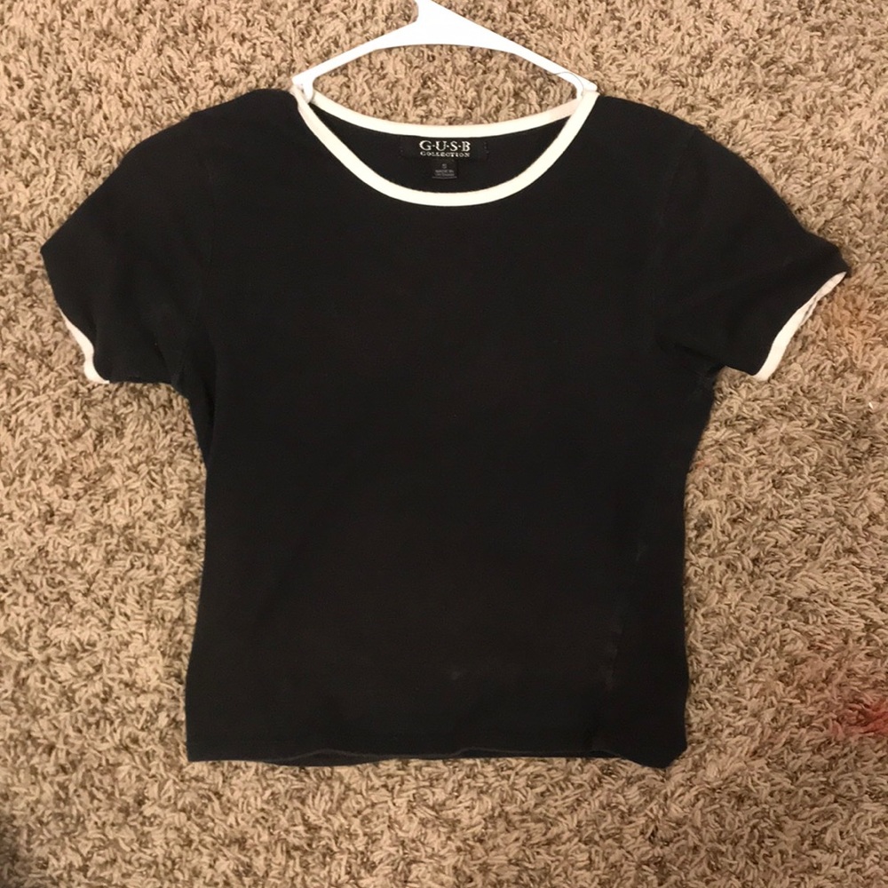 Black plain shirt. Length is to the end of stomach